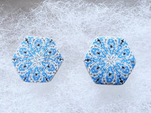 Load image into Gallery viewer, A close up picture of two hexagon shaped earrings with intricate white, silver and blue patterns.