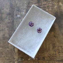 Load image into Gallery viewer, White and gold flowers on a purple background stud earrings in a white paper jewelry box